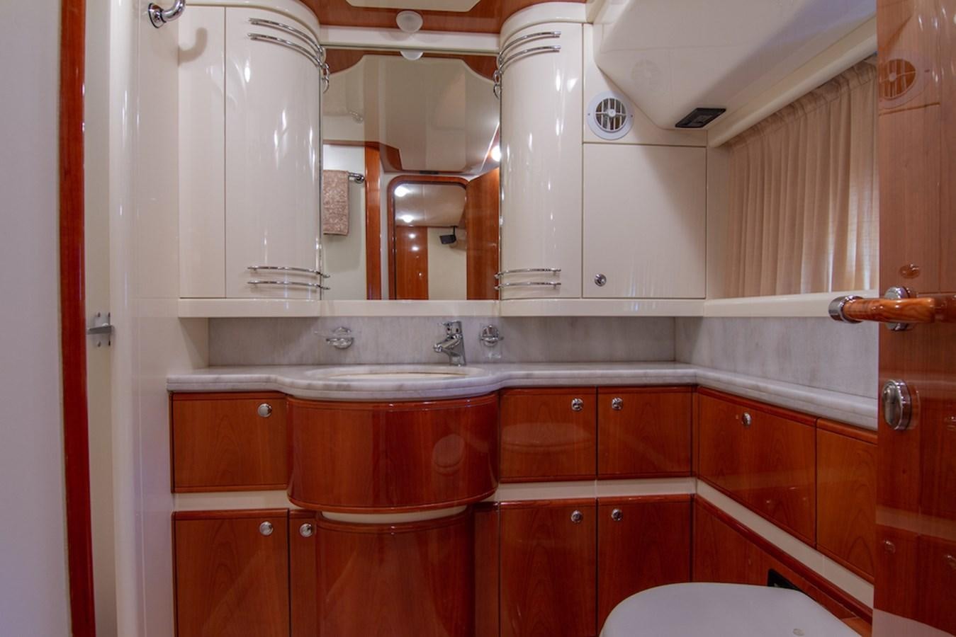 a kitchen with wooden cabinets aboard SEA PAL Yacht for Sale