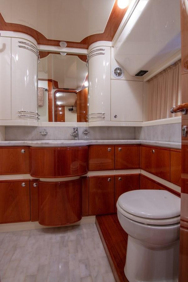 a bathroom with wooden cabinets aboard SEA PAL Yacht for Sale