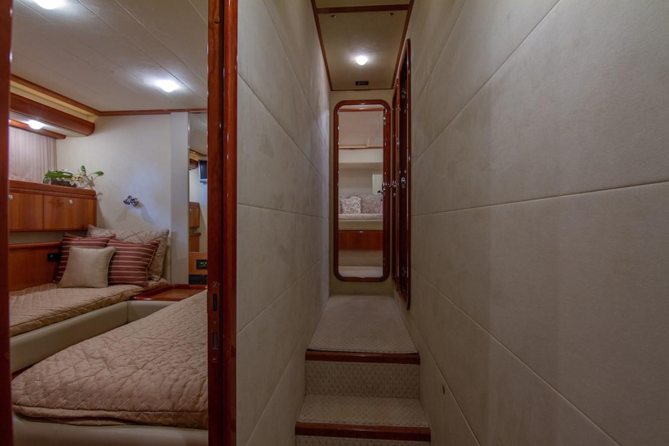 a room with a bed and a mirror aboard SEA PAL Yacht for Sale