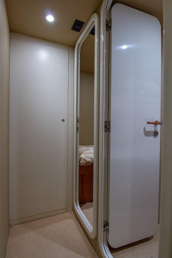 a white door with a mirror aboard SEA PAL Yacht for Sale