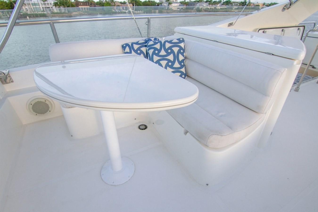 a white chair on a boat aboard SEA PAL Yacht for Sale