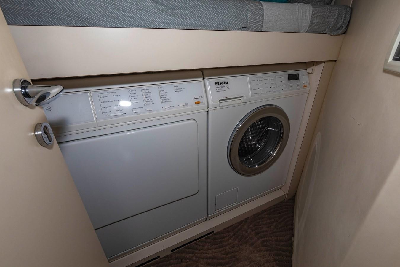 a washer and dryer in a room aboard FREE SPIRIT Yacht for Sale