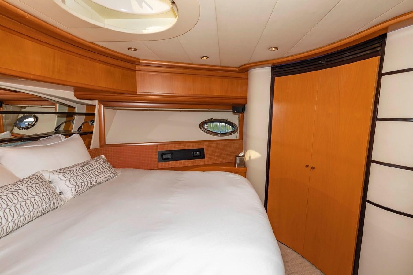 a room with a bed and a closet aboard FREE SPIRIT Yacht for Sale