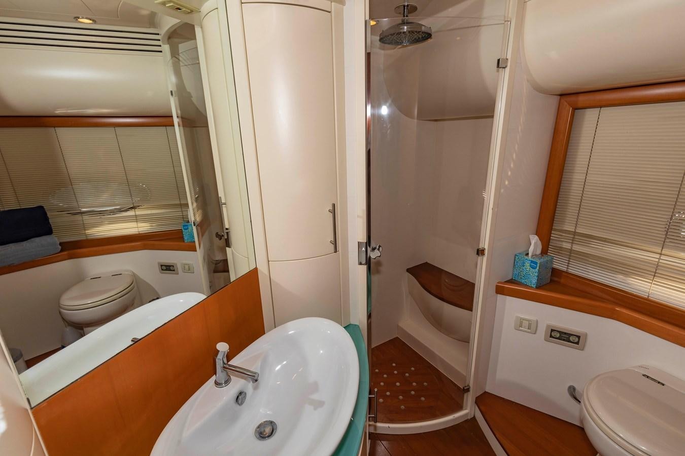 a bathroom with a tub sink and toilet aboard FREE SPIRIT Yacht for Sale