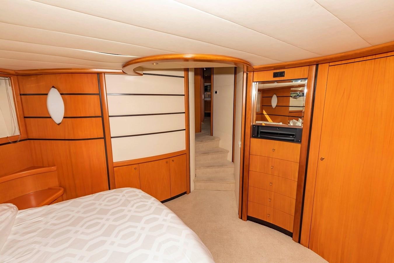 a room with a bed and a closet aboard FREE SPIRIT Yacht for Sale