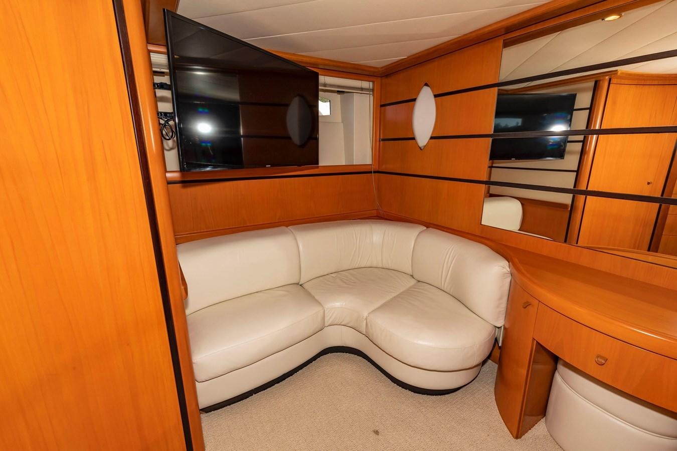 a room with a bed and a mirror aboard FREE SPIRIT Yacht for Sale