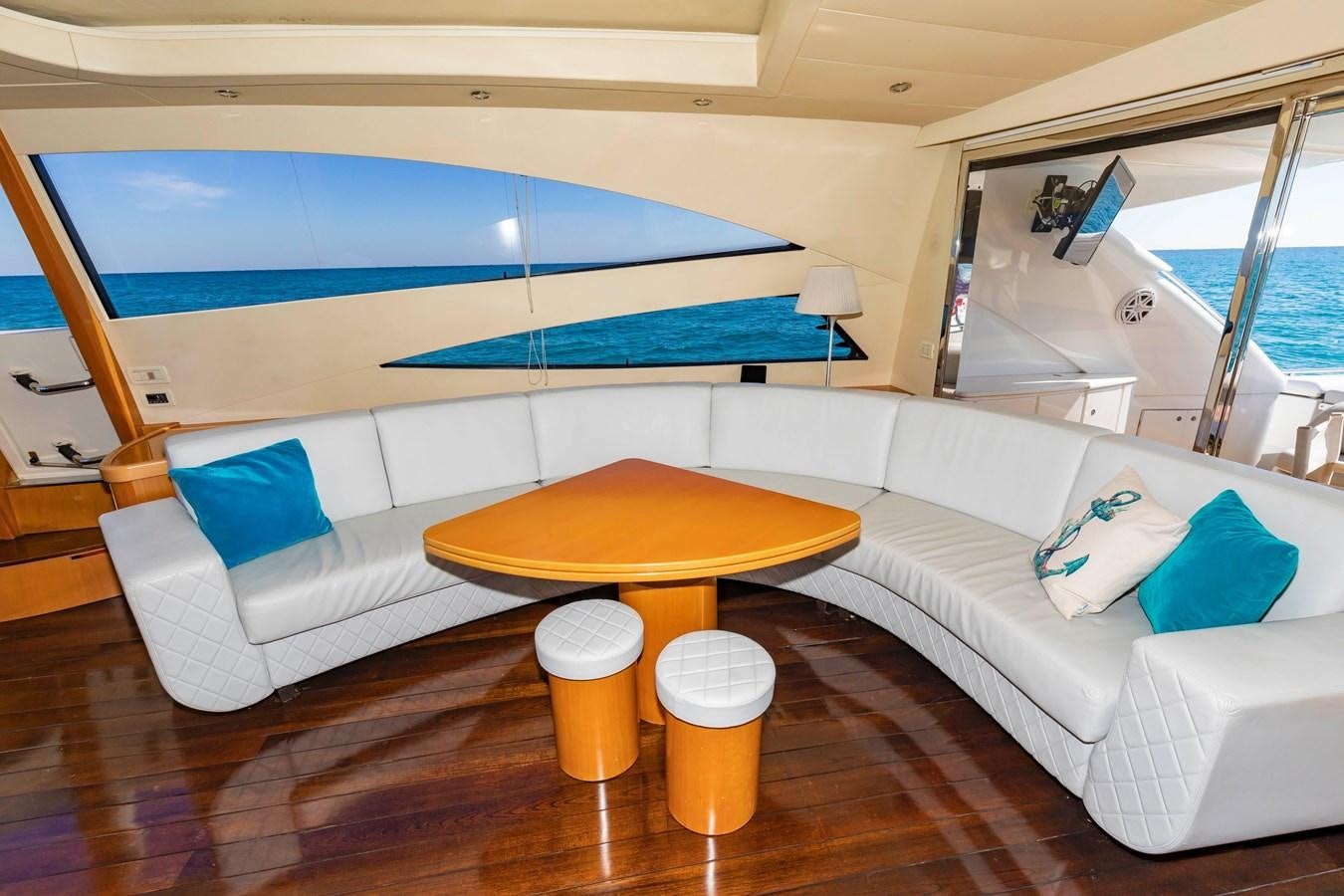 a room with a couch and a table aboard FREE SPIRIT Yacht for Sale