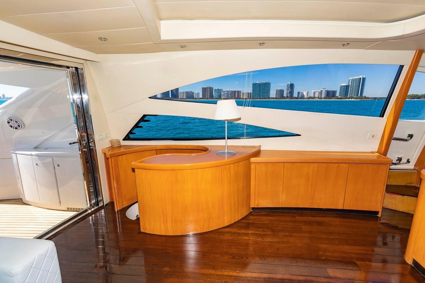 a room with a table and a tv aboard FREE SPIRIT Yacht for Sale