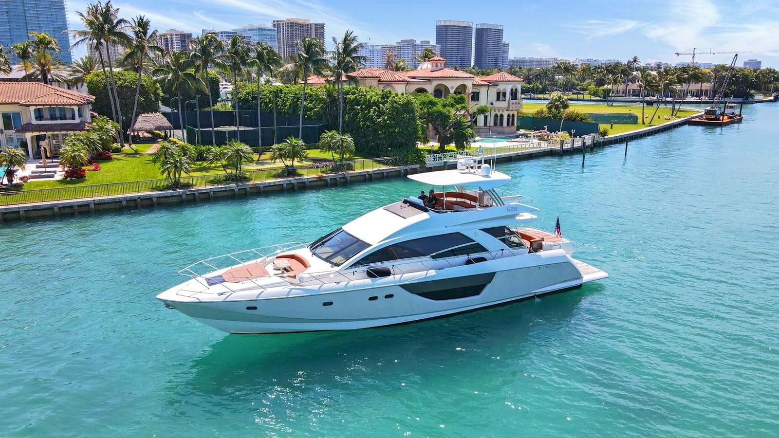 a white boat in the water aboard Gramercy 28 Yacht for Sale