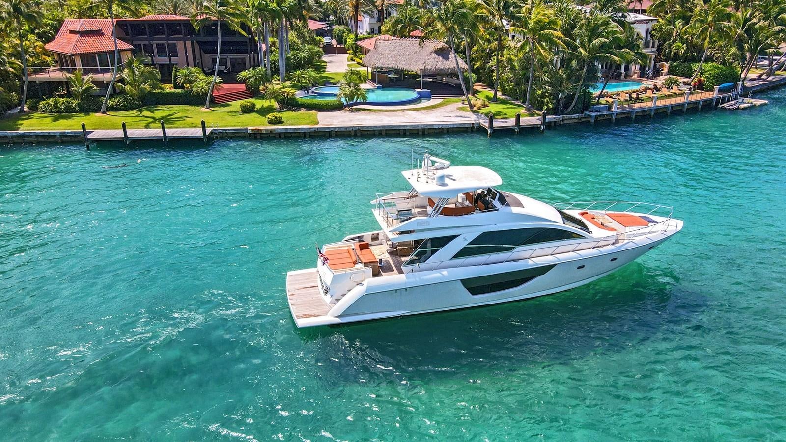 a white boat in a body of water aboard Gramercy 28 Yacht for Sale