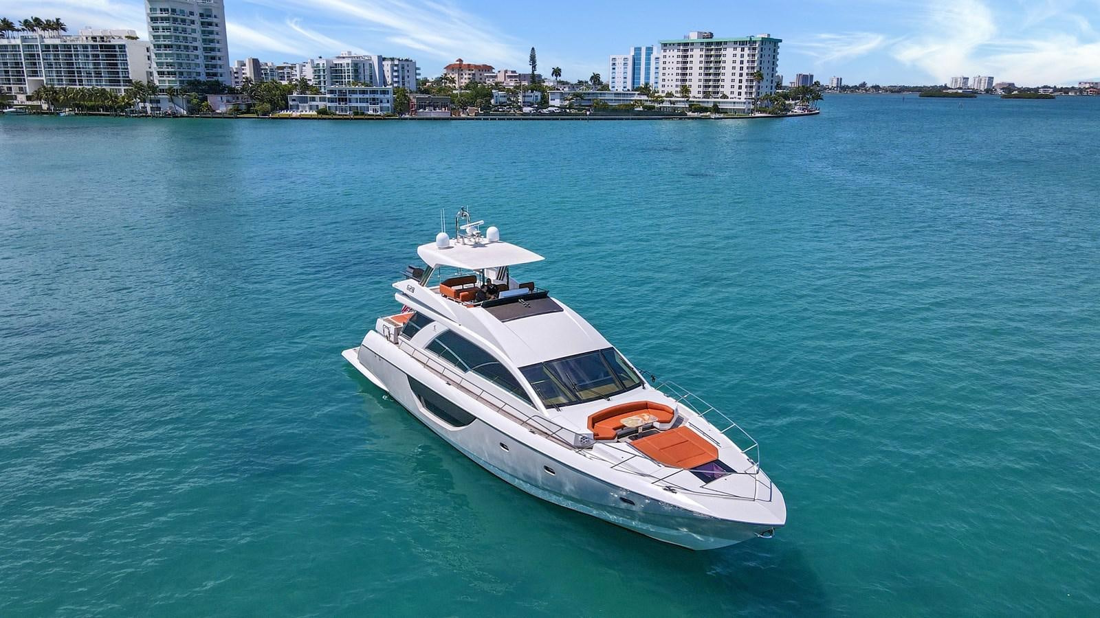 a white boat in the water aboard Gramercy 28 Yacht for Sale