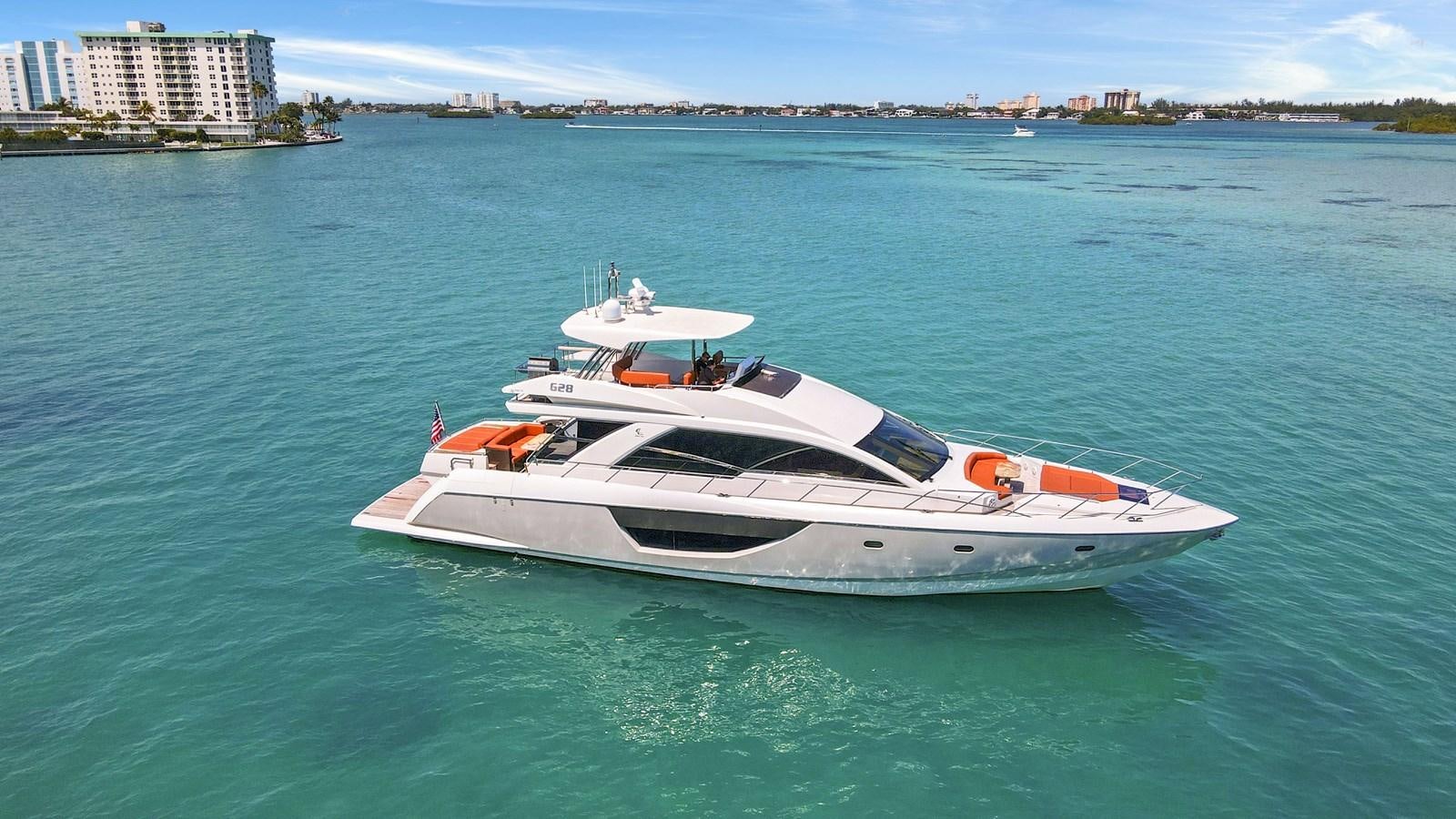 a white boat in the water aboard Gramercy 28 Yacht for Sale