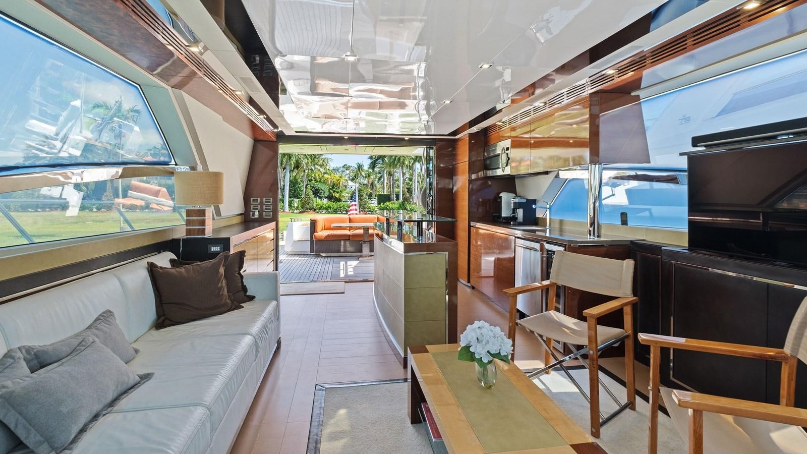 a living room with a large window aboard Gramercy 28 Yacht for Sale