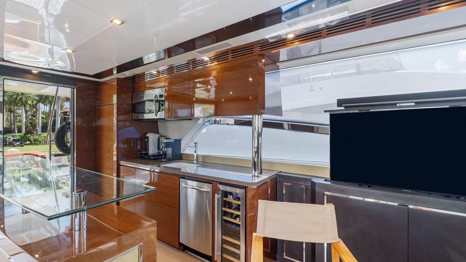 a kitchen with a glass door aboard Gramercy 28 Yacht for Sale
