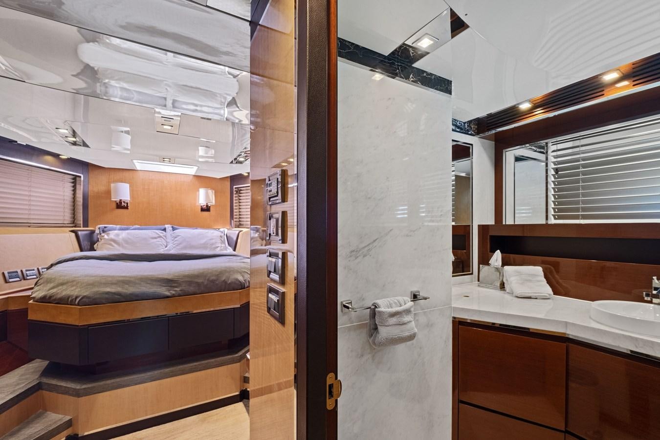 a room with a bed and a sink aboard Gramercy 28 Yacht for Sale