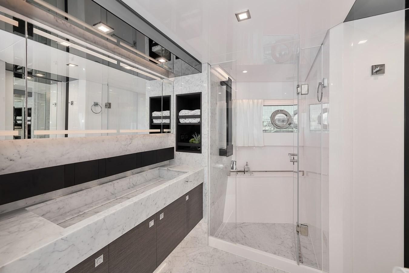 a bathroom with a large mirror aboard FD75  709 Yacht for Sale