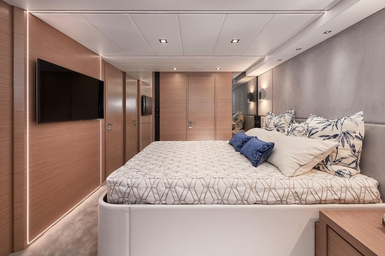 a room with a bed and a television aboard FD75  709 Yacht for Sale