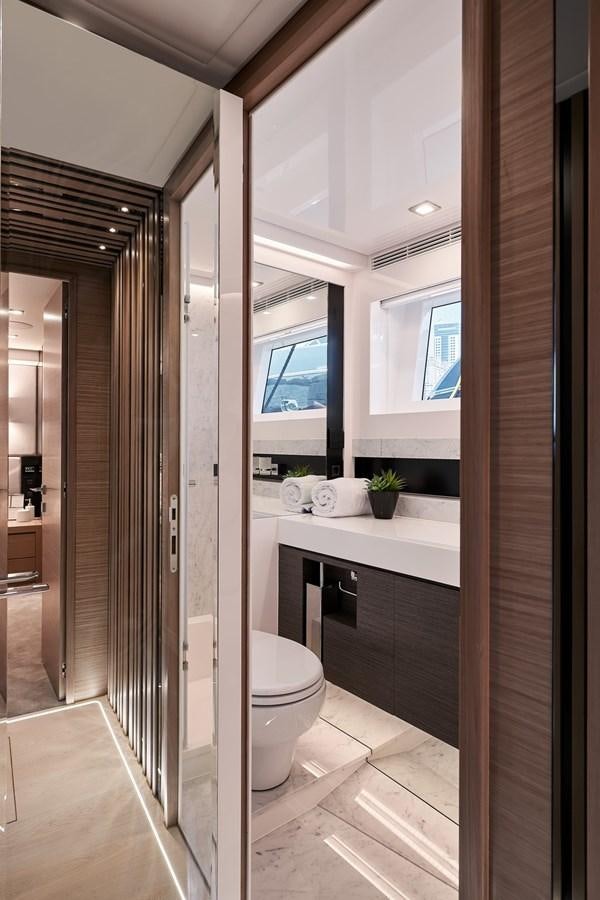 a bathroom with a glass shower aboard FD75  709 Yacht for Sale