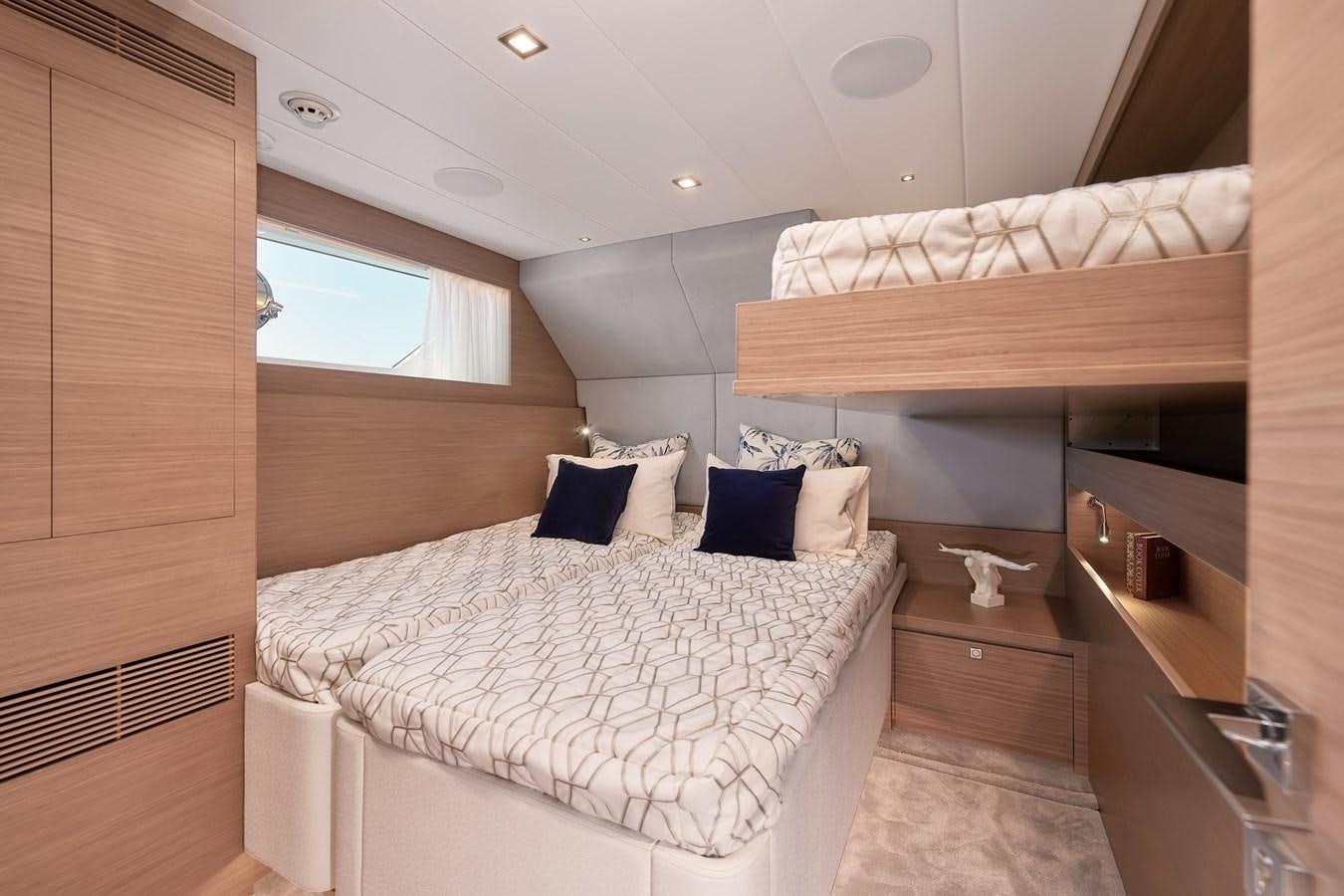 a bedroom with a bed and a stair case aboard FD75  709 Yacht for Sale
