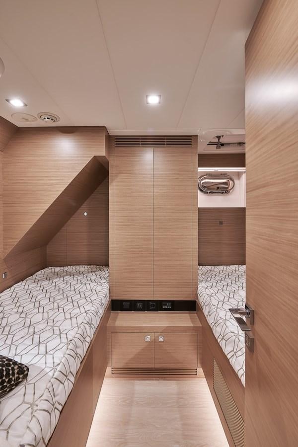 a room with a bed and a wood door aboard FD75  709 Yacht for Sale