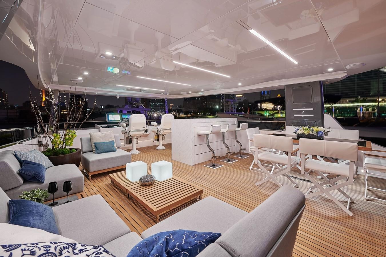 a room with tables chairs and a couch aboard FD75  709 Yacht for Sale