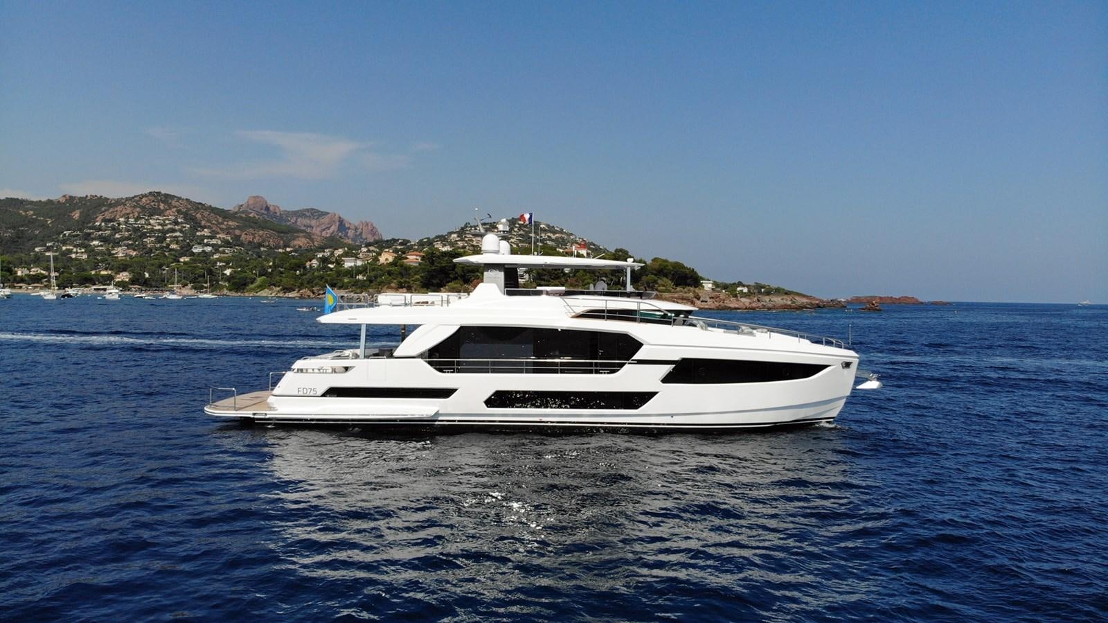 a white boat in the water aboard FD75  709 Yacht for Sale