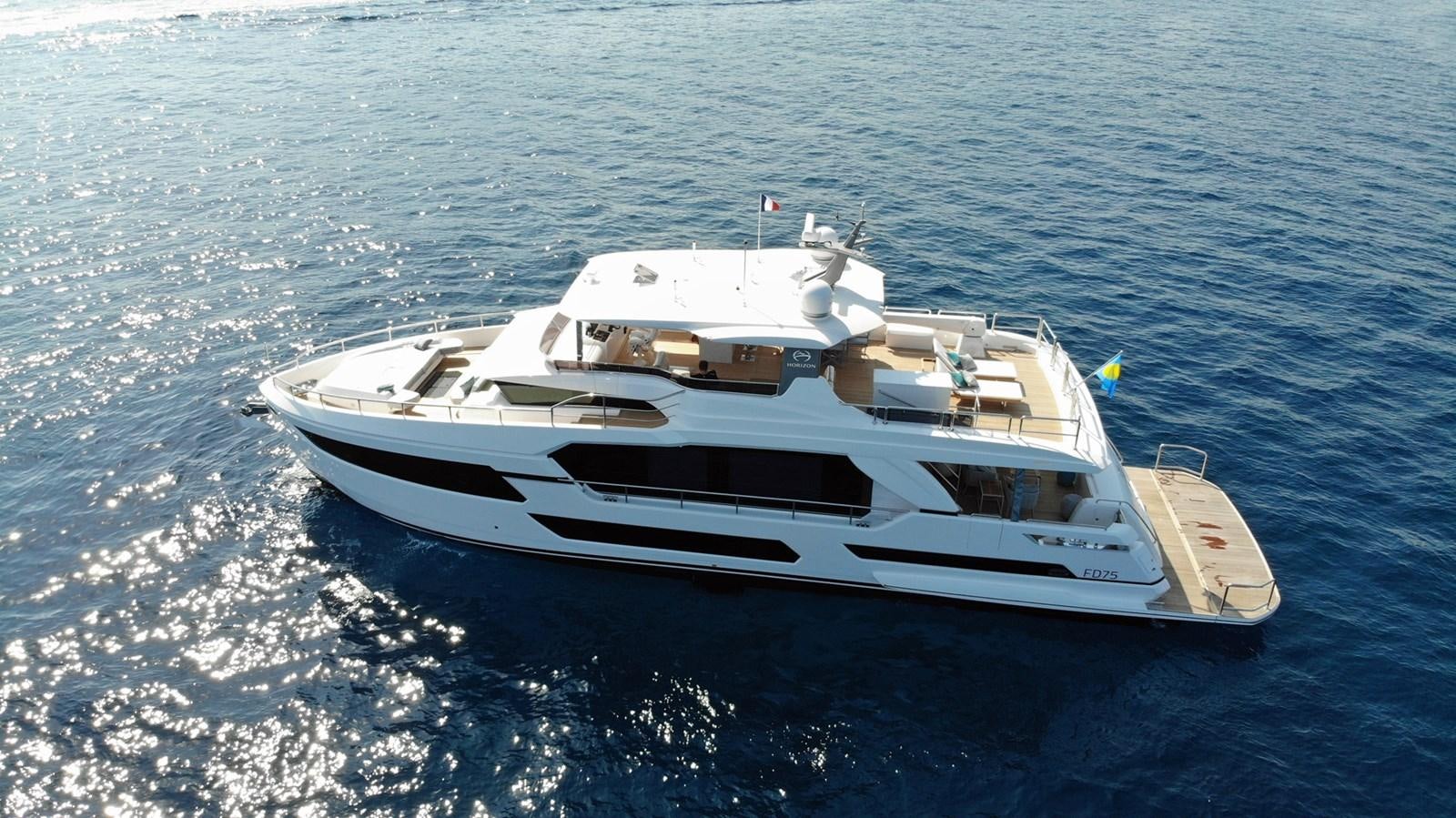 a white boat in the water aboard FD75  709 Yacht for Sale