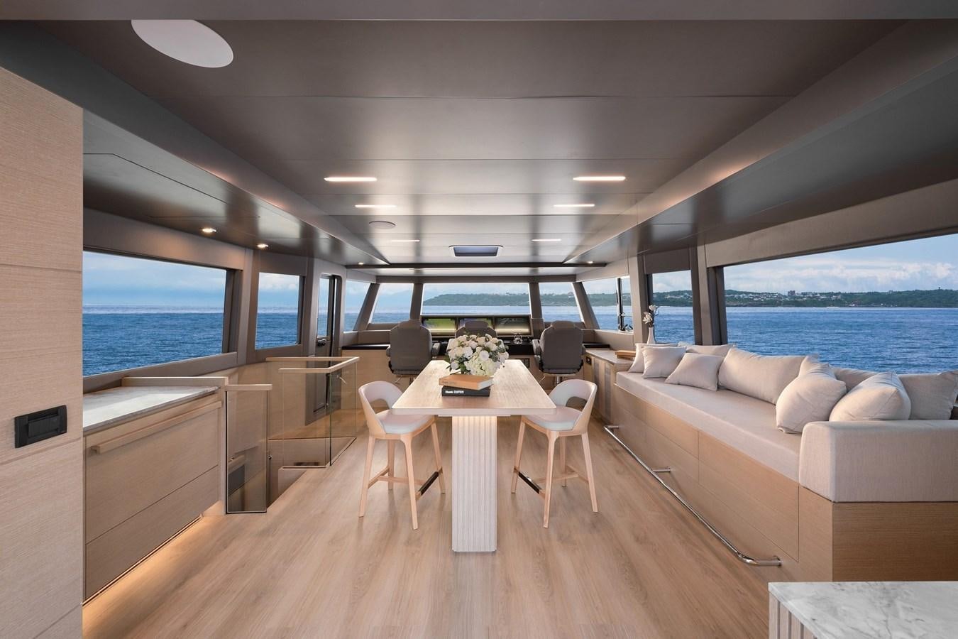 a room with a table and chairs aboard FD75  709 Yacht for Sale