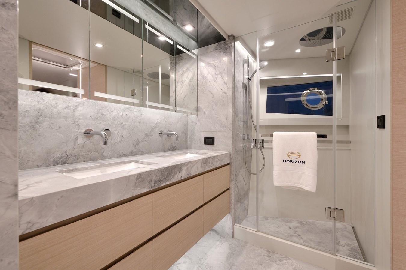 a bathroom with a large bathtub aboard FD75  709 Yacht for Sale