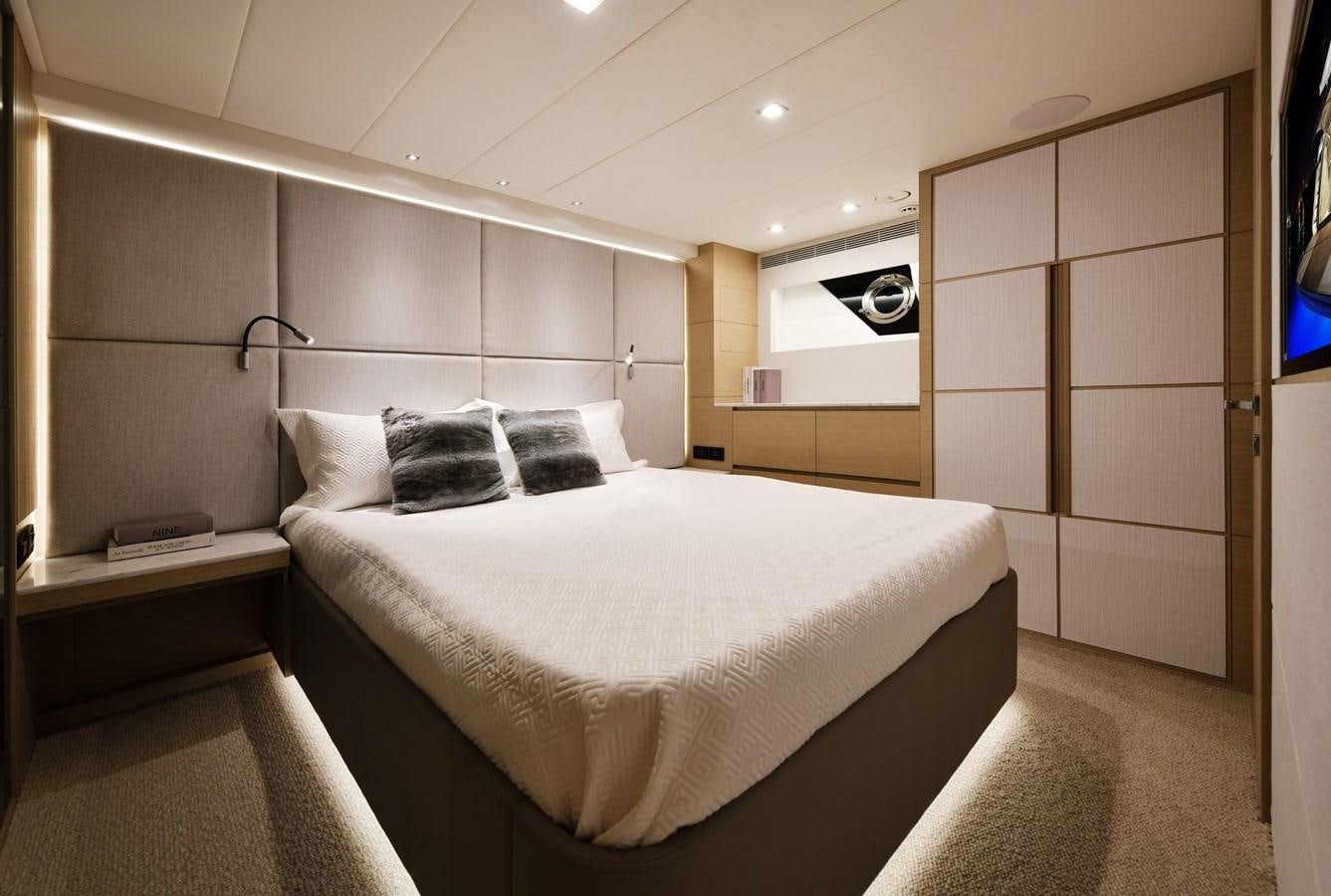 a room with a bed and a mirror aboard FD75  709 Yacht for Sale