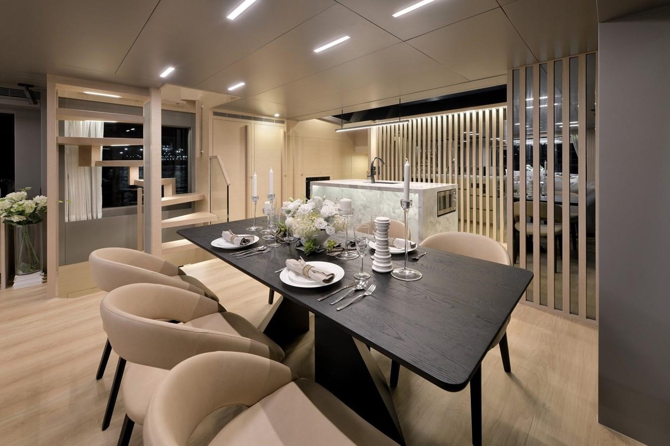 a dining room with a table and chairs aboard FD75  709 Yacht for Sale