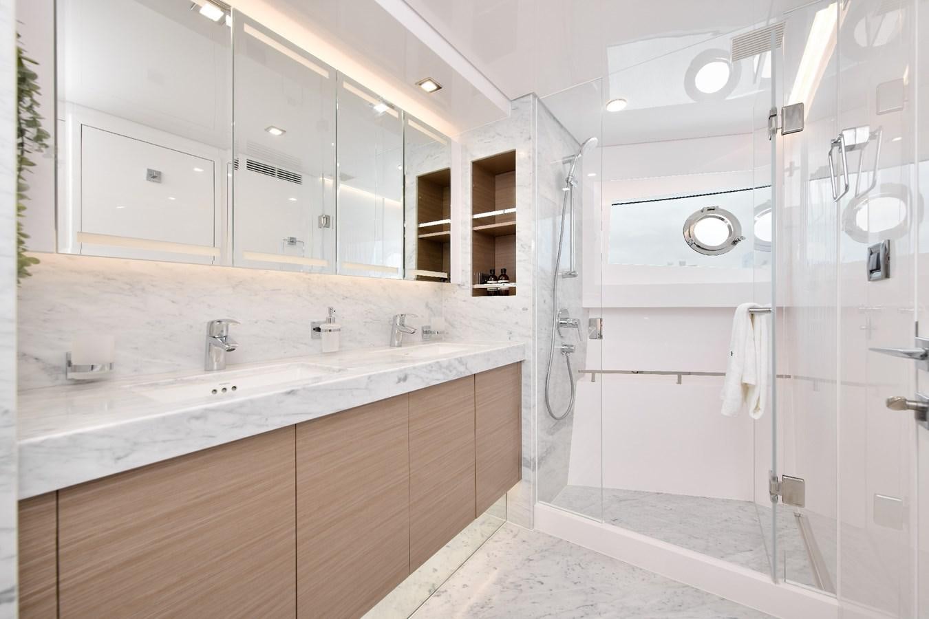 a bathroom with a large mirror aboard FD75  709 Yacht for Sale