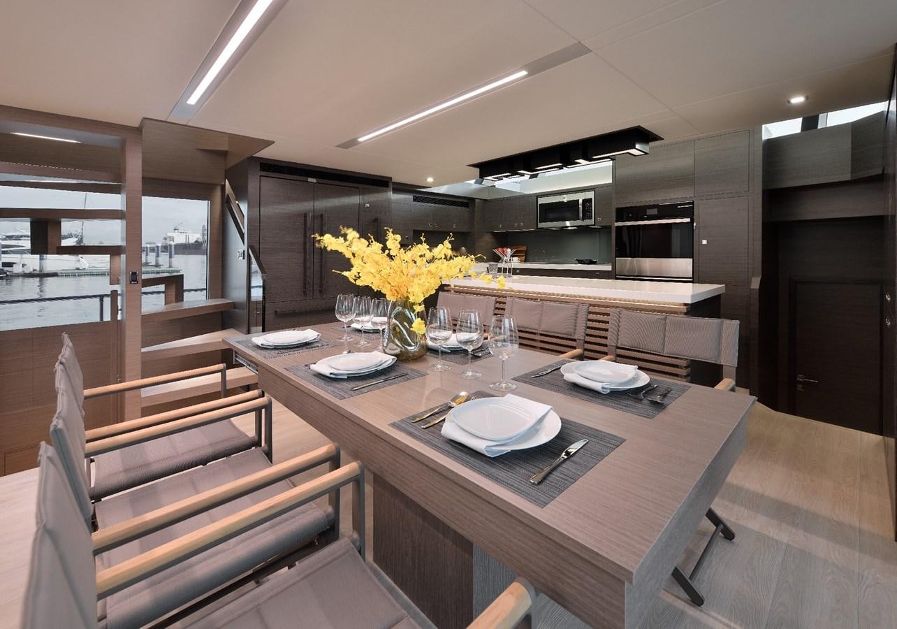 a kitchen with a table and chairs aboard FD75  709 Yacht for Sale