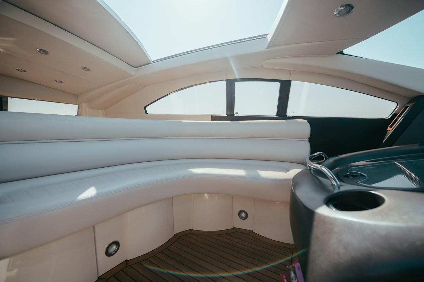 a white kitchen with a black pot aboard HOURI Yacht for Sale