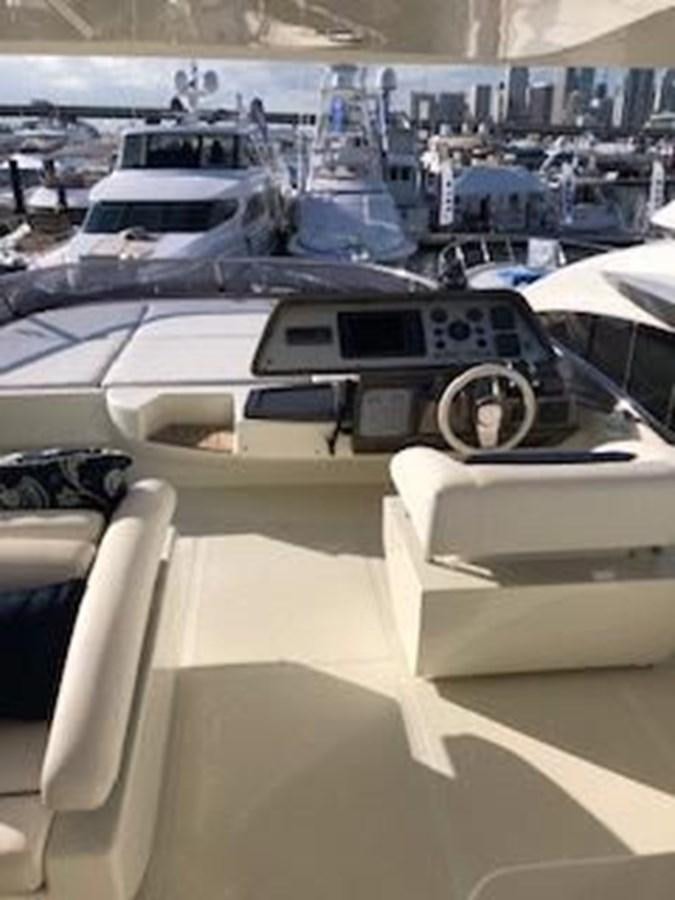 a group of white cars aboard 2013 RIVA 75 VENERE SUPER Yacht for Sale