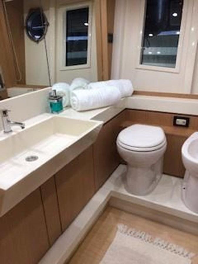 a bathroom with a sink toilet and a bathtub aboard 2013 RIVA 75 VENERE SUPER Yacht for Sale