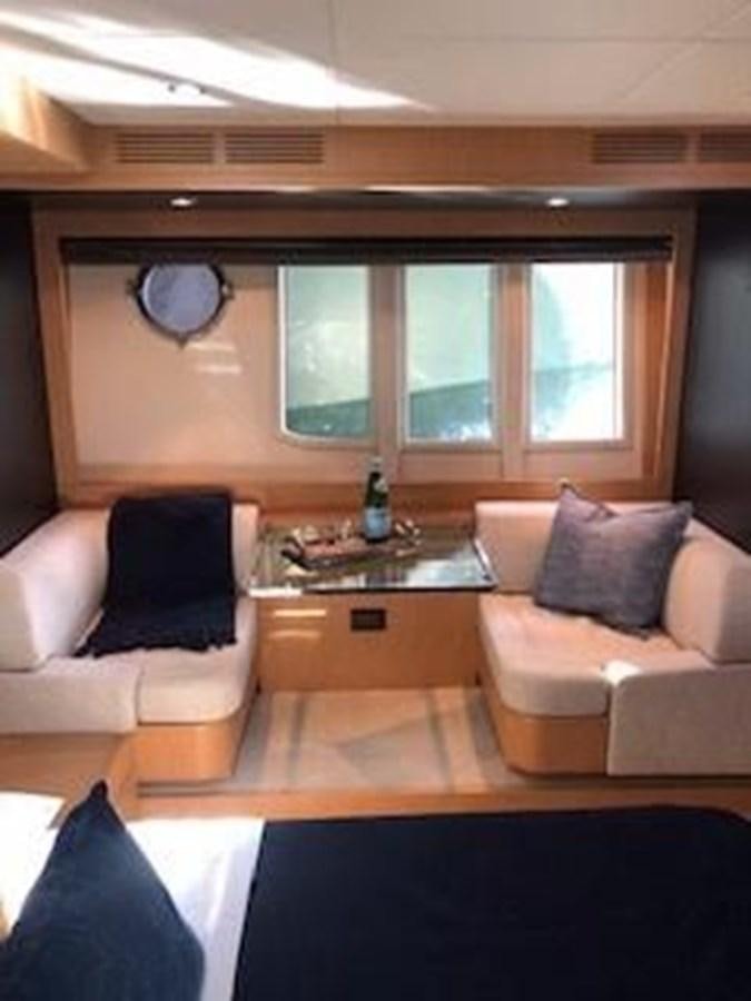 a living room with a couch and a coffee table aboard 2013 RIVA 75 VENERE SUPER Yacht for Sale