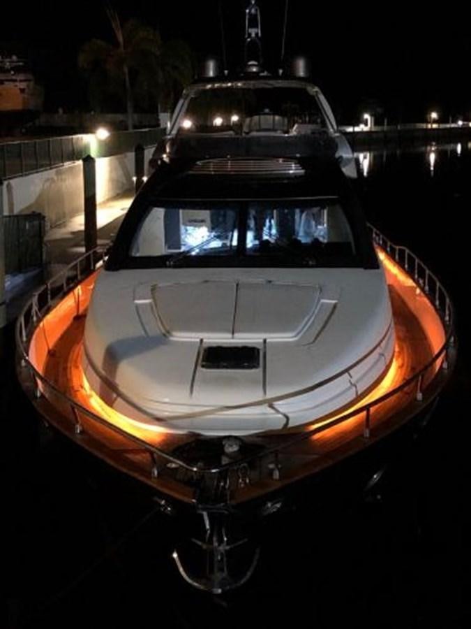 a car with its lights on aboard 2013 RIVA 75 VENERE SUPER Yacht for Sale