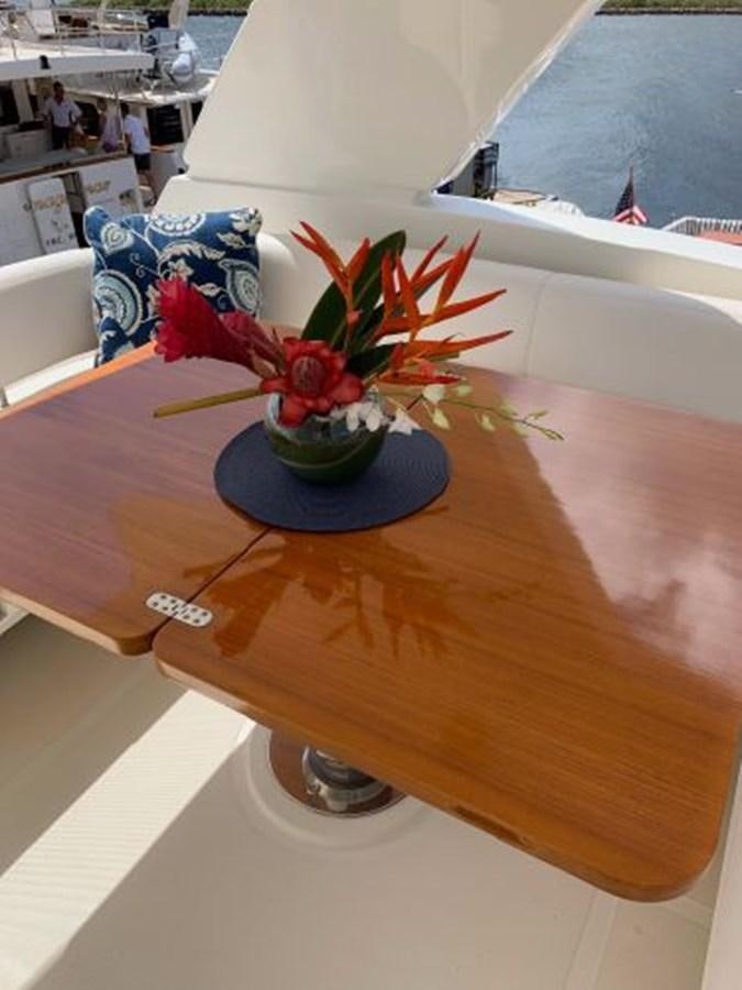 a vase with flowers on a table aboard 2013 RIVA 75 VENERE SUPER Yacht for Sale