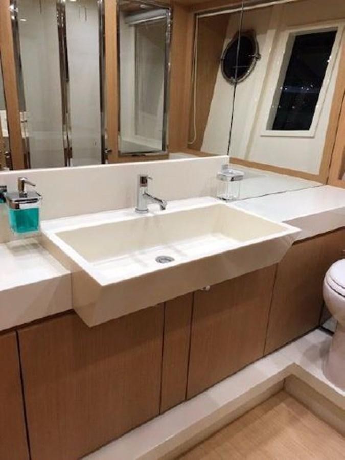 a bathroom with a sink and a mirror aboard 2013 RIVA 75 VENERE SUPER Yacht for Sale