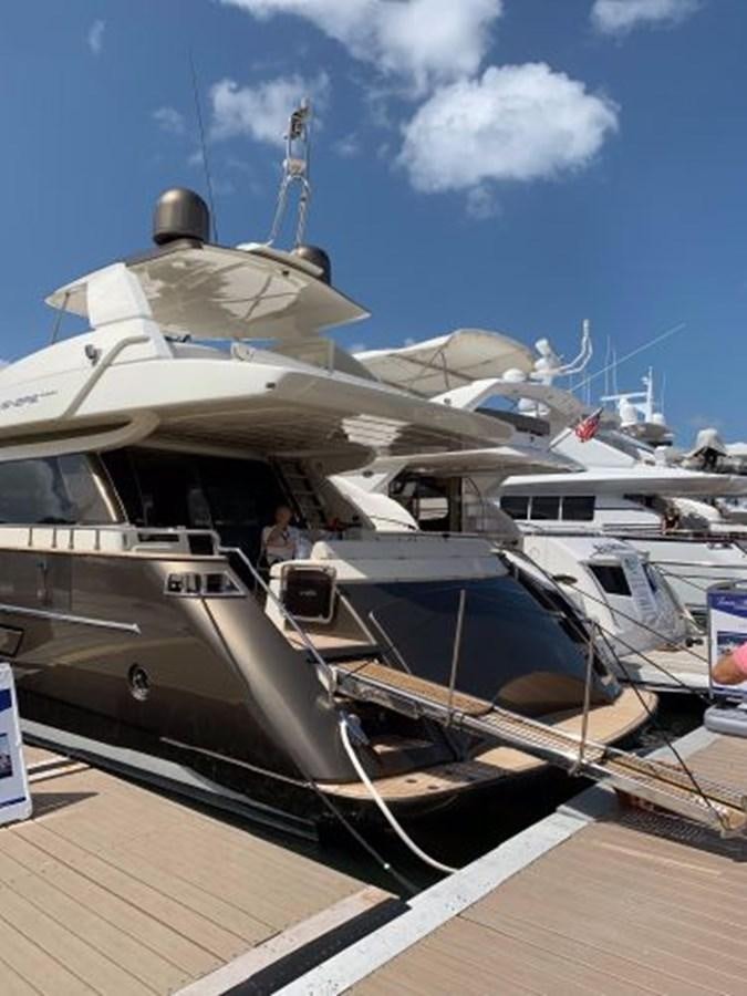 a boat docked at a pier aboard 2013 RIVA 75 VENERE SUPER Yacht for Sale