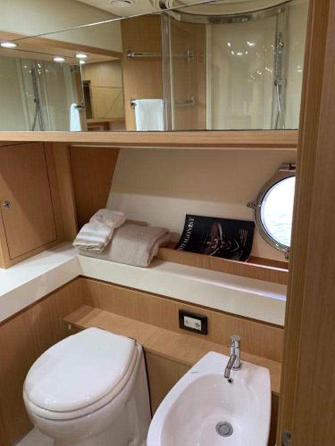 a bathroom with a sink and a mirror aboard 2013 RIVA 75 VENERE SUPER Yacht for Sale