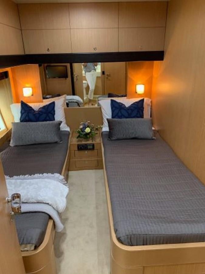 a room with a bed and a dresser aboard 2013 RIVA 75 VENERE SUPER Yacht for Sale