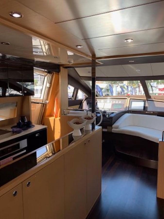 a room with a bed and a desk aboard 2013 RIVA 75 VENERE SUPER Yacht for Sale