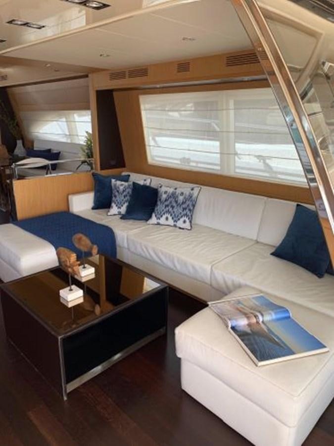 a living room with a couch and a coffee table aboard 2013 RIVA 75 VENERE SUPER Yacht for Sale