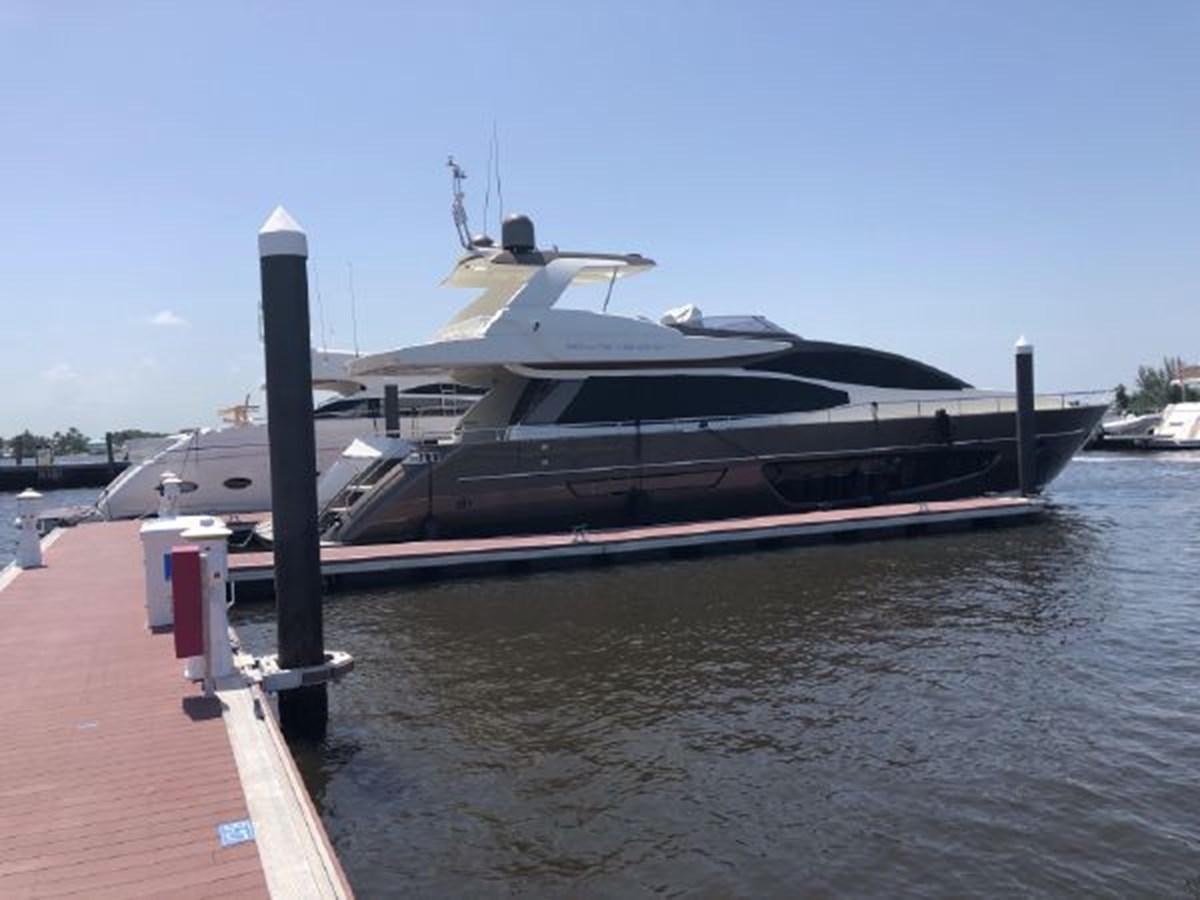 a boat docked at a pier aboard 2013 RIVA 75 VENERE SUPER Yacht for Sale