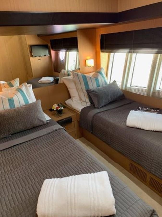 a bedroom with two beds aboard 2013 RIVA 75 VENERE SUPER Yacht for Sale