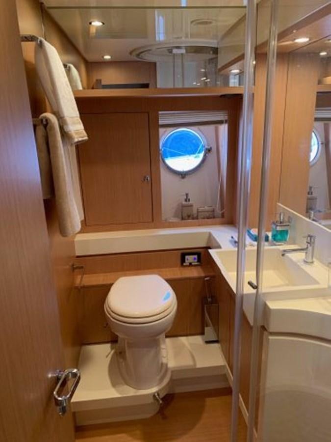 a bathroom with a toilet and sink aboard 2013 RIVA 75 VENERE SUPER Yacht for Sale