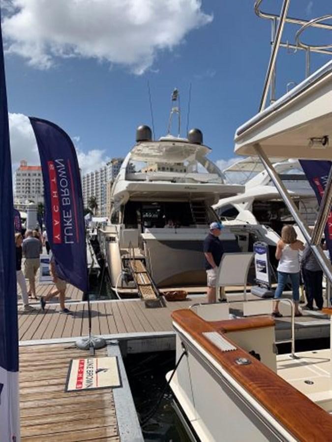 a boat docked at a pier aboard 2013 RIVA 75 VENERE SUPER Yacht for Sale
