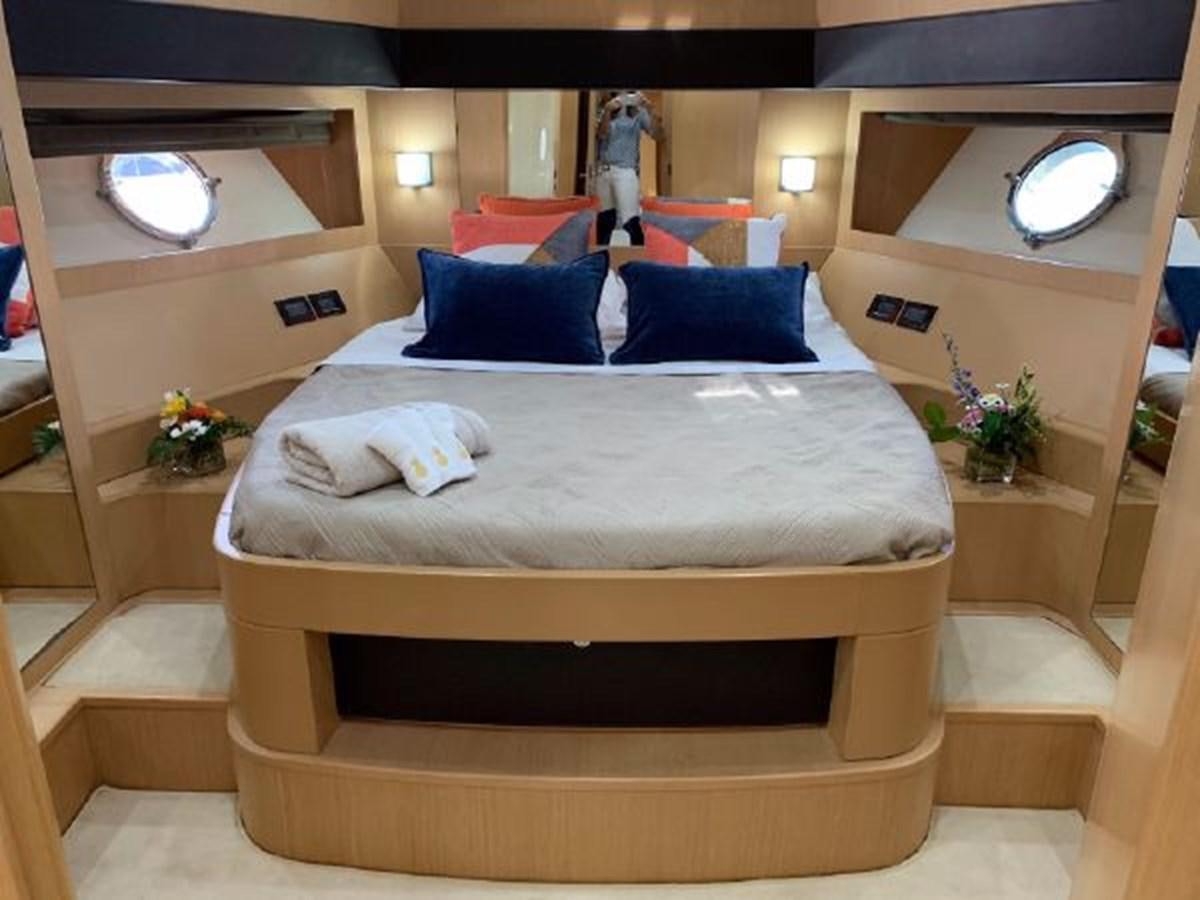a bed with a white sheet and pillows on it aboard 2013 RIVA 75 VENERE SUPER Yacht for Sale